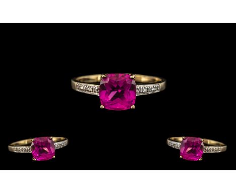 9ct Gold Pink Topaz &amp; Diamond Dress Ring, set with a cushion cut central stone between diamond chip shoulders.  Fully hal