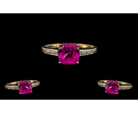 9ct Gold Pink Topaz &amp; Diamond Dress Ring, set with a cushion cut central stone between diamond chip shoulders.  Fully hal