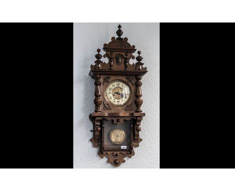 Late 19th Century Walnut Drop Dial Wall Clock cream dial with Arabic numerals.  Art Nouveau embossed copper centre.  The case