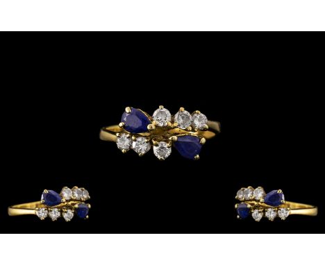 18ct Gold - Good Quality Sapphire and Diamond Set Dress Ring. Marked 750 - 18ct. The Round Brilliant Cut Diamonds of Commerci