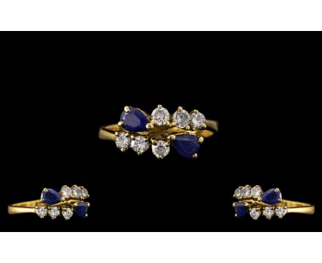 18ct Gold - Good Quality Sapphire and Diamond Set Dress Ring. Marked 750 - 18ct. The Round Brilliant Cut Diamonds of Commerci