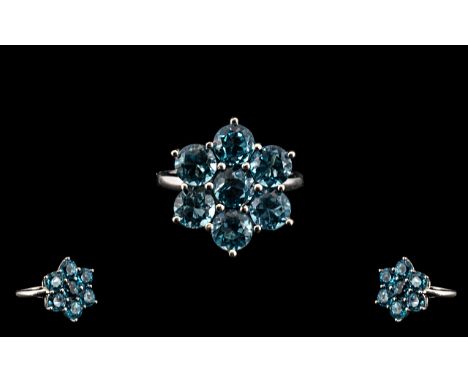 Blue Topaz Silver Dress Ring.  Lovely flower head design Topaz ring, set in silver, fully hallmarked.  Ring size R.  Please s