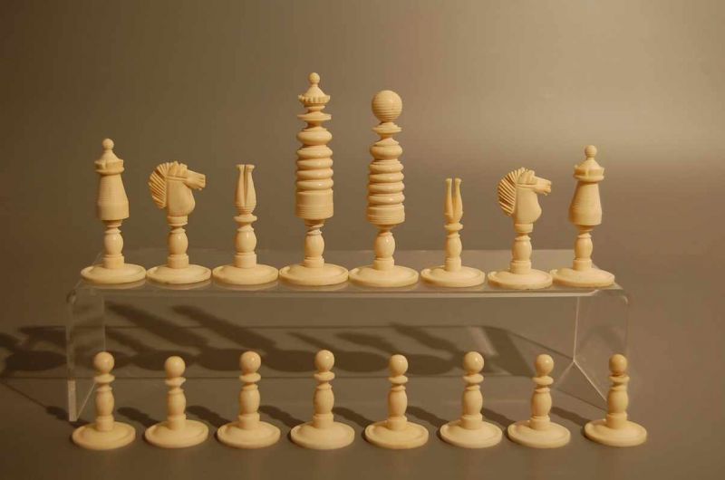 A fine turned and carved chess set in the 'George Washington' style ...