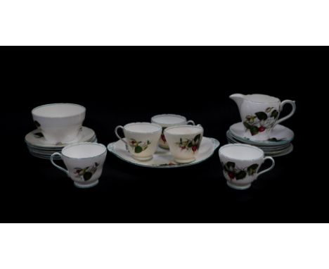 A Shelley porcelain part tea service decorated in the Fuchsia pattern, No 82395, printed and painted marks, comprising bread 