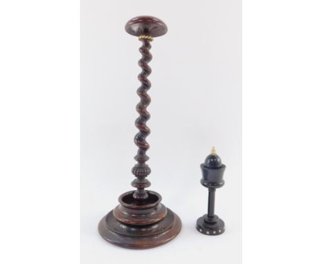Two 19thC sewing aids, comprising an ebonised bobbin holder, with bone acorn finial and removable top, on a circular studded 