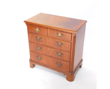 A 20thC chest, the wide crossbanded top raised above two short and three long drawers, each with swan neck plate back handles