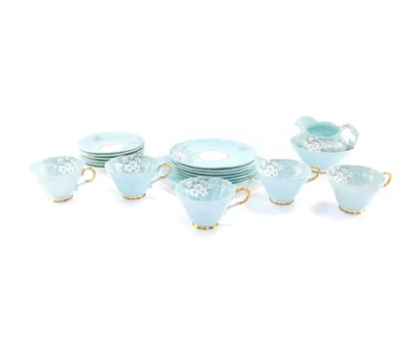 A Paragon porcelain early 20thC part tea service, decorated with white primroses against a turquoise ground, printed mark, co