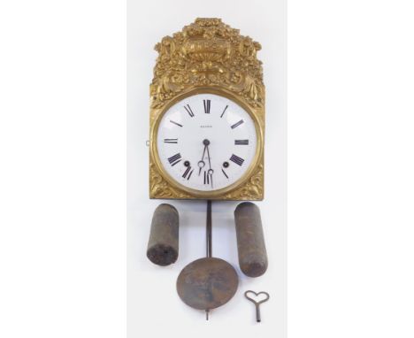 Jeannin A' Buxy. A 19thC gilt brass comtoise wall clock, with elaborate repousse decoration, with urns, scrolls and flower he