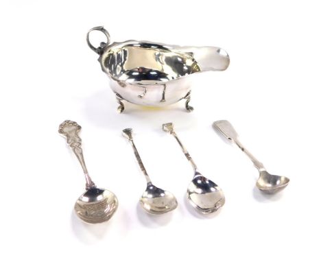 A George V silver sauce boat, raised on three feet, Chester 1915., a pair of George V silver seal topped coffee spoons, Birmi