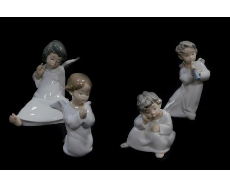 A Lladro porcelain figure of a seated cherub, and three further cherubs, one praying, another in contemplation, the third pla