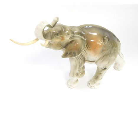 A Royal Dux porcelain figure of an elephant, trunk raised, no. 378/2 79, impressed and printed marks beneath, tusks replaceme