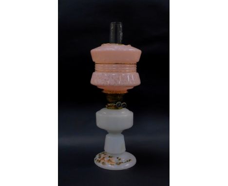 A Victorian milk glass oil lamp base, with brass mount, partially painted with flowers, with later shade and clear glass funn