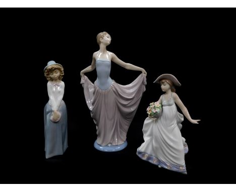 A Lladro porcelain figure modelled as Dancer, 05050., another modelled as Care Free, 05790., both boxed, together with a Nao 