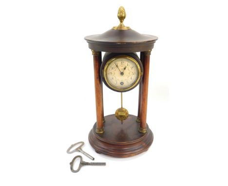 A German early 20thC wooden cased portico clock, circular dial bearing Arabic numerals, the case raised on four columns and a