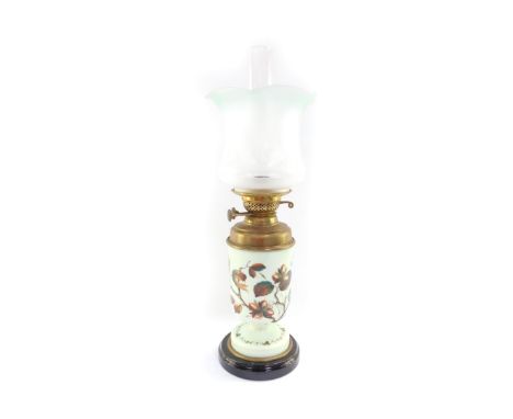 A Duplex late 19thC glass and brass oil lamp, painted with cob nuts against a pale green ground, with chimney and green to cl