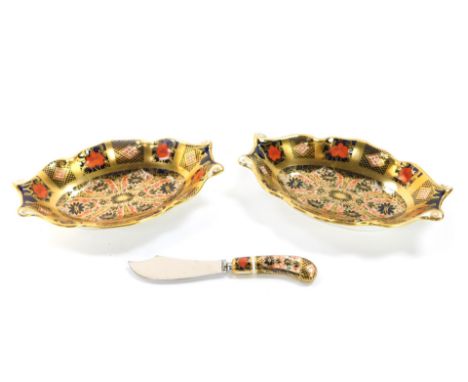 A pair of Royal Crown Derby imari sweetmeat dishes, of oval twin handled form, pattern no 1128, together with a butter knife.