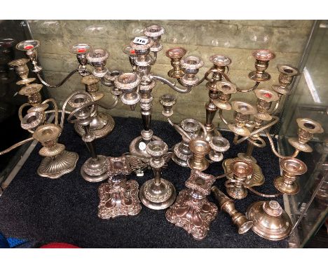 SHELF OF ELECTRO PLATED ON COPPER CANDELABRUMS AND DWARF CANDLE STICKS 