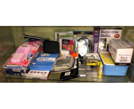 SHELF CONTAINING MP3 HANDS FREE KIT, TENS PAIN RELIEF UNIT, SURGE, PROTECTOR PLUG, MOUNT FOR MOBILES, ETC