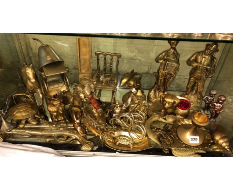 BOTTOM SHELF OF ORNAMENTAL BRASSWARES INCLUDING FIGURES, HORSES, HEARTH ORNAMENTS