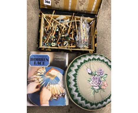 BOX OF VINTAGE SEWING AND LACE BOBBINS, PIN CUSHION AND TEMPLATE BOOK