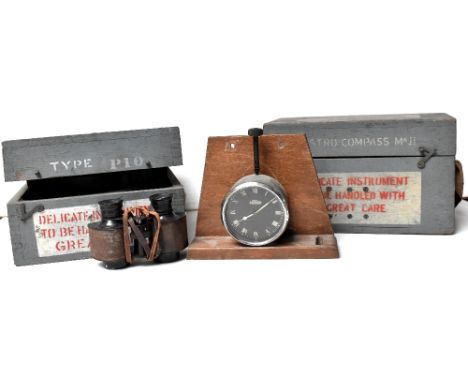Two boxed military compasses, a Type P10 No.44536 and a boxed military Astro compass Mk II, a pair of metal field glasses and