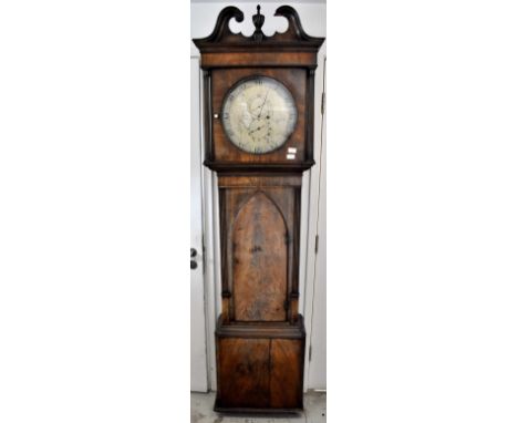 An early 19th century mahogany thirty-hour longcase clock, broken swan neck pediment above a circular silvered dial with chap