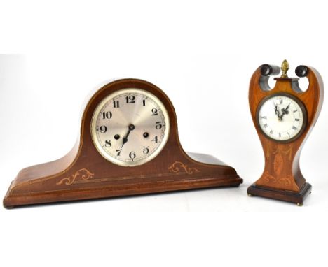 An Edwardian inlaid mahogany mantel clock, the painted dial set with Roman numerals, enclosing a modern battery movement, wit
