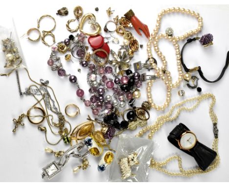 A quantity of vintage and later costume jewellery to include clip-on earrings, faux pearl necklaces, various brooches, a boxe