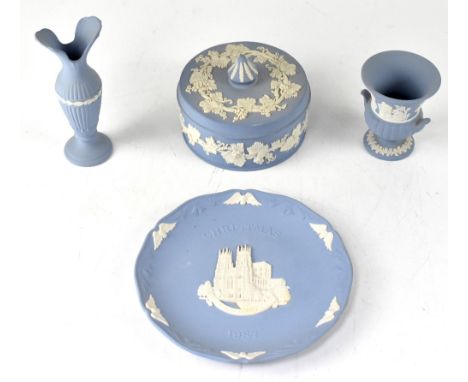 A good collection of Wedgwood eggshell blue jasper ware to include a pair of short candlesticks, an oval tray, two large lidd