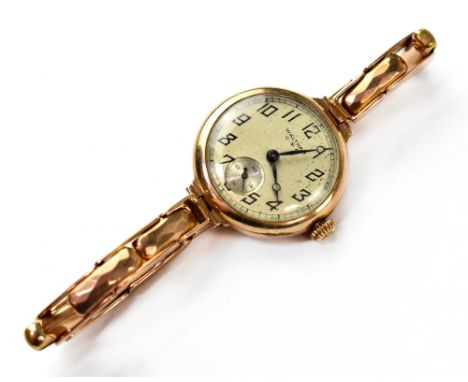 Waltham USA; a ladies' vintage 9ct gold wristwatch, the silvered dial set with Arabic numerals with smaller subsidiary dial, 