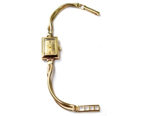 OLMA; a ladies' 9ct gold wristwatch, manual wind movement, the square silvered dial set with Arabic numerals, on a 9ct gold d