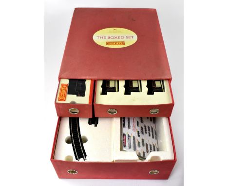 A Hornby Dublo boxed set containing engine 35012 United States Lines Navy Class, three carriages, Ibis, Cygnus and Minerva, a