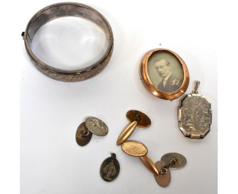 A 9ct gold oval brooch with gentleman's portrait photograph, a silver bangle engraved with flora, a rectangular silver locket