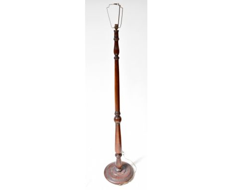 An early/mid-20th century mahogany turned standard lamp to spreading circular base, height 150cm.