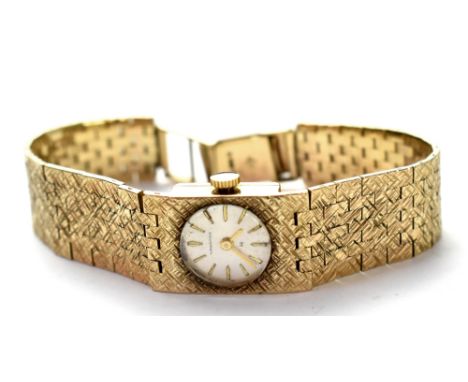 Hamilton; a 1970s ladies' 9ct gold wristwatch, manual wind movement, the silvered dial set with raised baton numerals, on 9ct