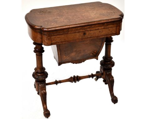 A Victorian burr walnut games table, the rectangular top opening to inlaid checker board and backgammon board, and cribbage b