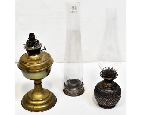 A silver plated oil lamp with ball-shaped reservoir, with a glass funnel, height 12cm and a brass oil lamp with tall glass fu