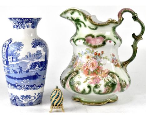 A quantity of blue and white ware to include Willow pattern oval and round serving plates, various mugs, teapot, water jug, b
