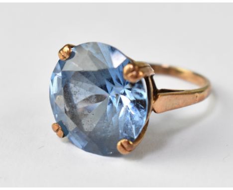 A 9ct yellow gold ladies' dress ring set with blue faceted stone, tests as tourmaline, size K, approx 6.4g.