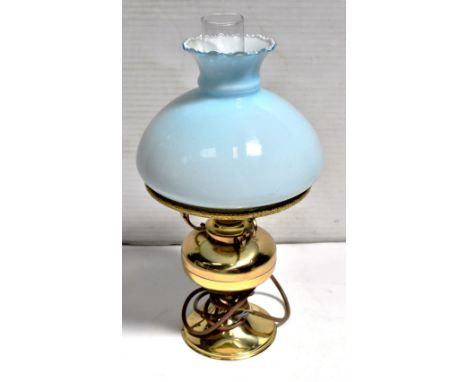 A brass oil lamp with opaque blue glass shade, converted to electricity and a modern lava lamp (2).