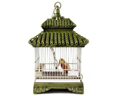 A Chinese ceramic lamp in the form of a bird cage, a ceramic table lamp in the form of a Chinese sage and seven other modern 