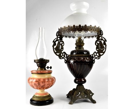 Two early/mid-20th century ceramic oil lamps to include a large brown baluster example with sailing ship metal decoration sup