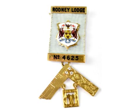 A 14ct gold Masonic medal, the blue ribbon for 'Rodney Lodge, No.4625', on bars, with central enamelled shield, the set squar
