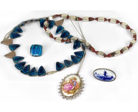 An Alice Lund, Denmark ceramic and blue glazed necklace, with one matching earring, Wedgwood brooch, a Delft brooch and a geo