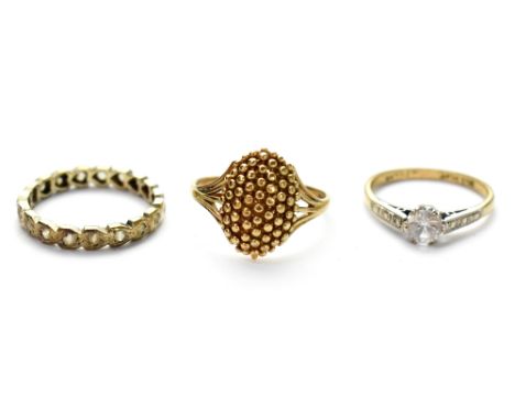 Three vintage 9ct gold dress rings to include a heart eternity ring, size N, a beaded cluster, size P and a single white ston