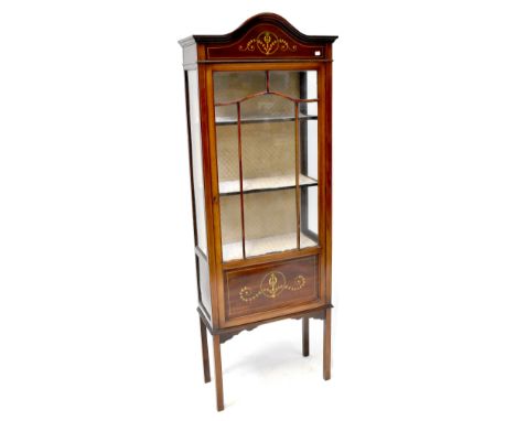 An Edwardian mahogany display cabinet, curved top rail above floral decoration to astragal glazed door, two interior shelves 