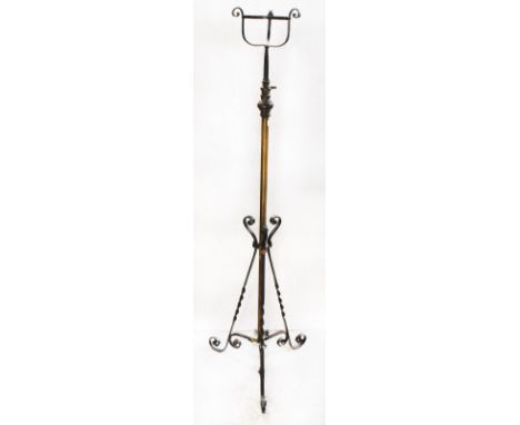 An Edwardian Arts &amp; Crafts style brass and wrought iron freestanding light converted from gas, height 150cm (no longer in