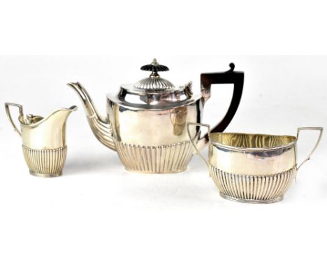  George V hallmarked silver three-piece bachelor's tea service comprising teapot, milk jug and sugar bowl, James Dixon &amp; 