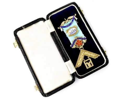 A Masonic silver gilt medal with enamelled badges fitted on a blue ribbon, dated 1947-48 with pendant beneath set with single