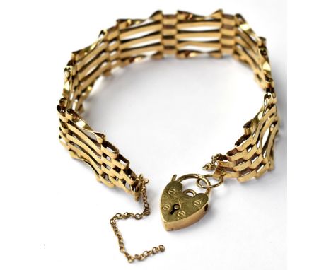 A 9ct gold five-bar gate bracelet with 9ct gold heart clasp, length 19cm, approx 10.7g.